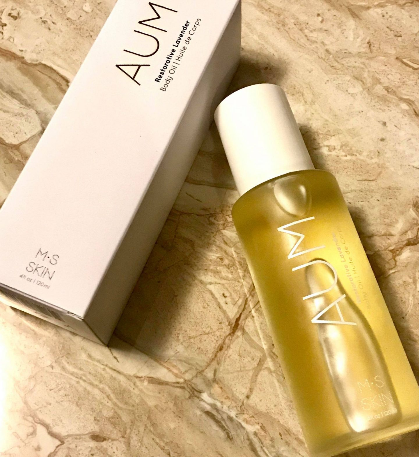 aum body oil