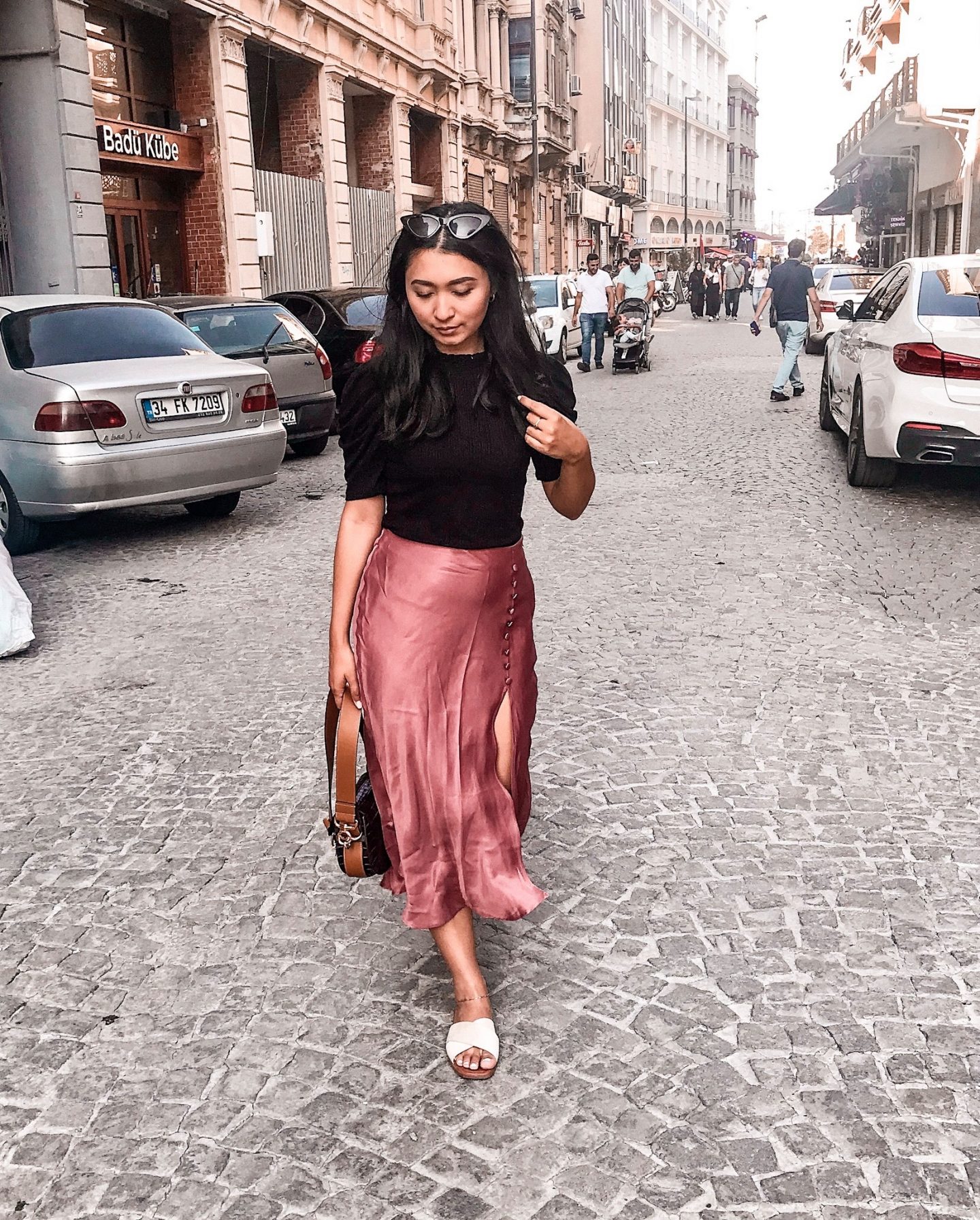 outfit 5- black shirt with puff sleeves, chloe bag, pink zara midi silky skirt with white sandals