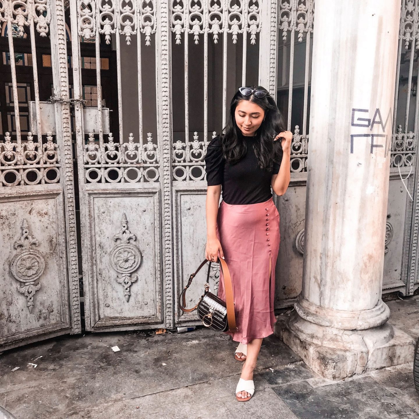 outfit 5- black shirt with puff sleeves, chloe bag, pink zara midi silky skirt with white sandals