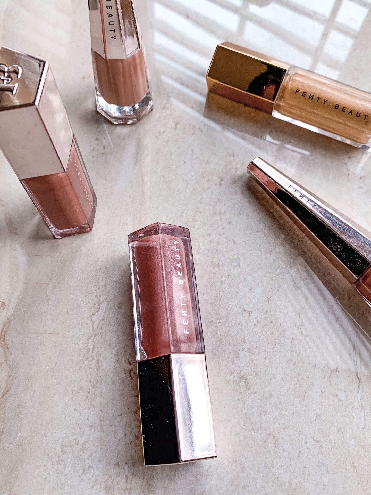 Fenty Beauty gloss bomb and lip stunna paint